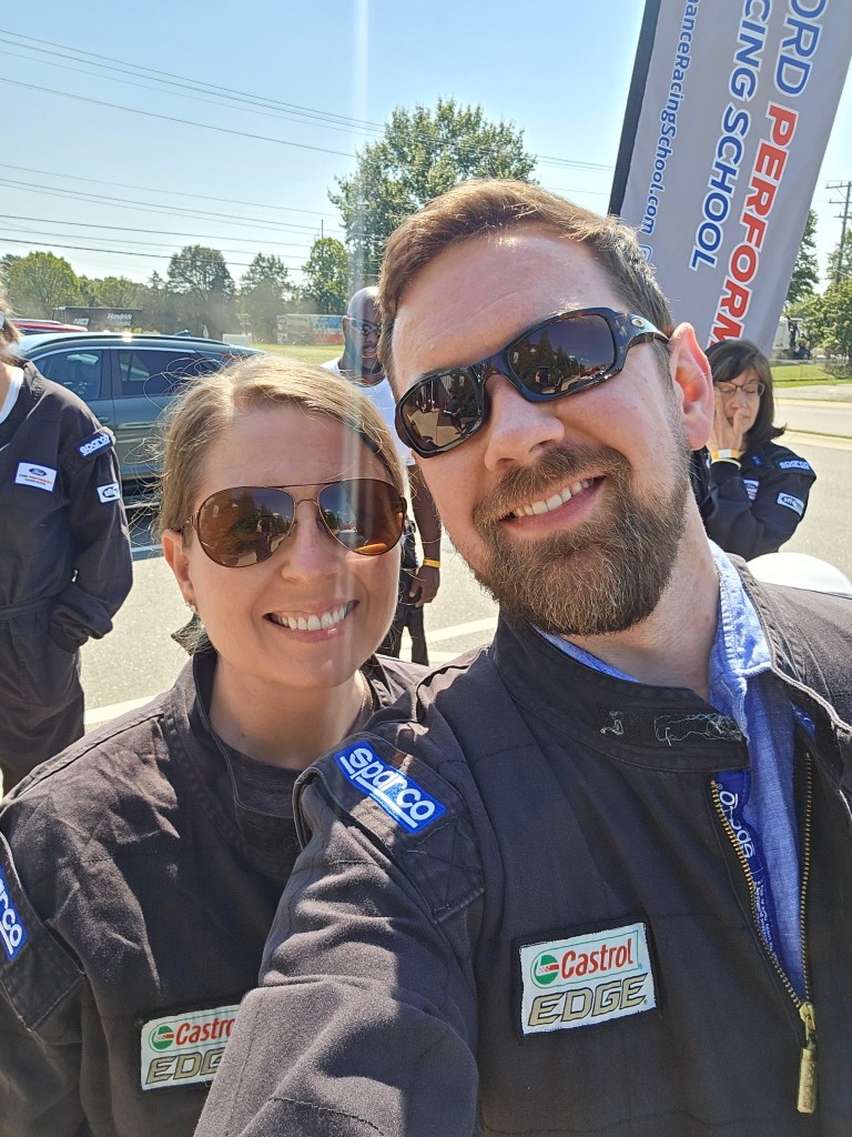 Dr. Laura Schwab Reese and Brandon Reese prepare to drive at the Ford Performance Racing School